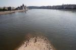 People stand on a shoal under the Margaret Bridge during the period of low water level in&nbsp;Budapest